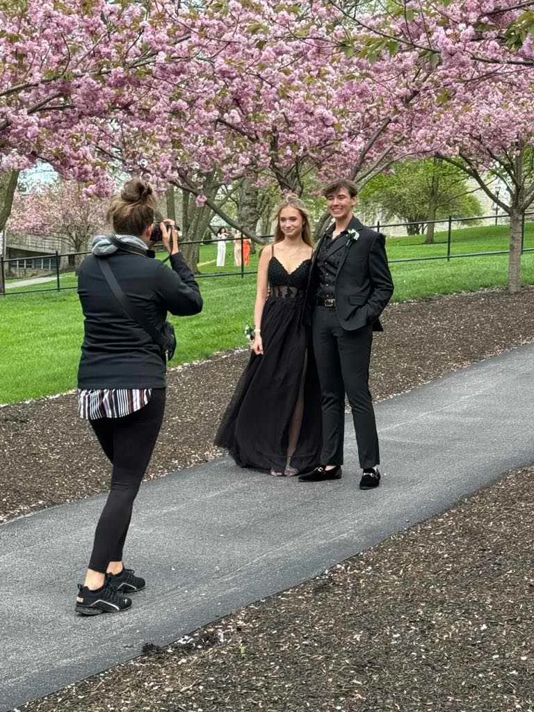 Photographer Betsy capturing moments during photo session